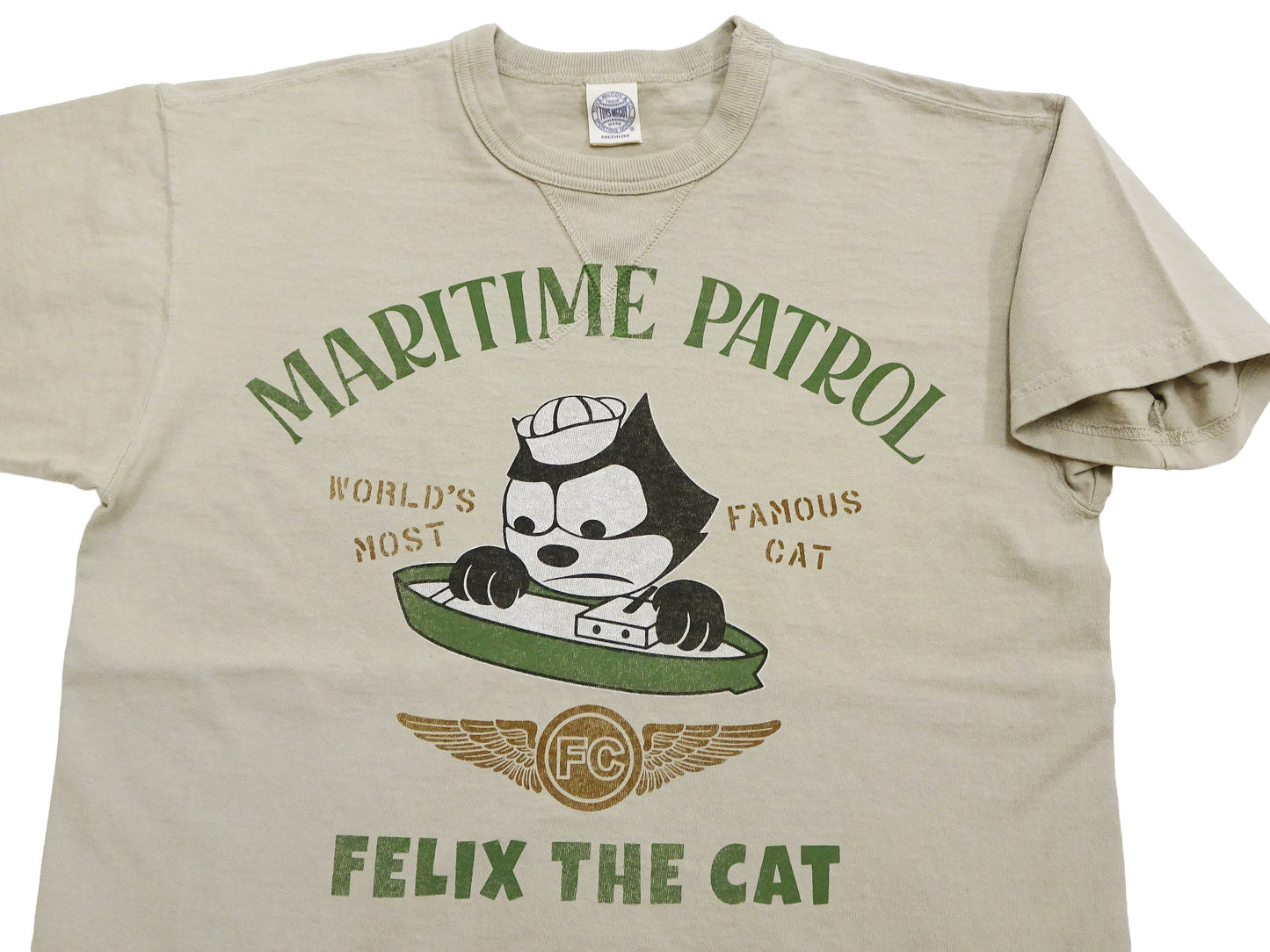 TOYS McCOY Men's Felix the Cat U.S. Navy Graphic Short Sleeve T-Shirt - Loopwheel Tubular Jersey, Garment Dyed, Made in Japan (TMC2601 041 Muted Sand Beige)